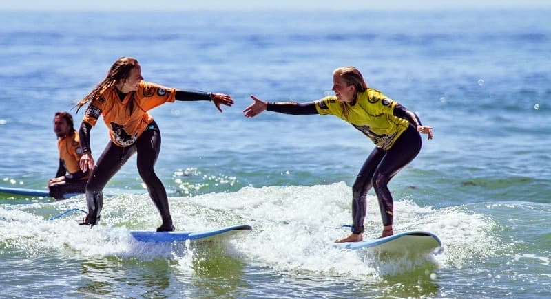 Surfer riding a wave during a private lesson in the Algarve
